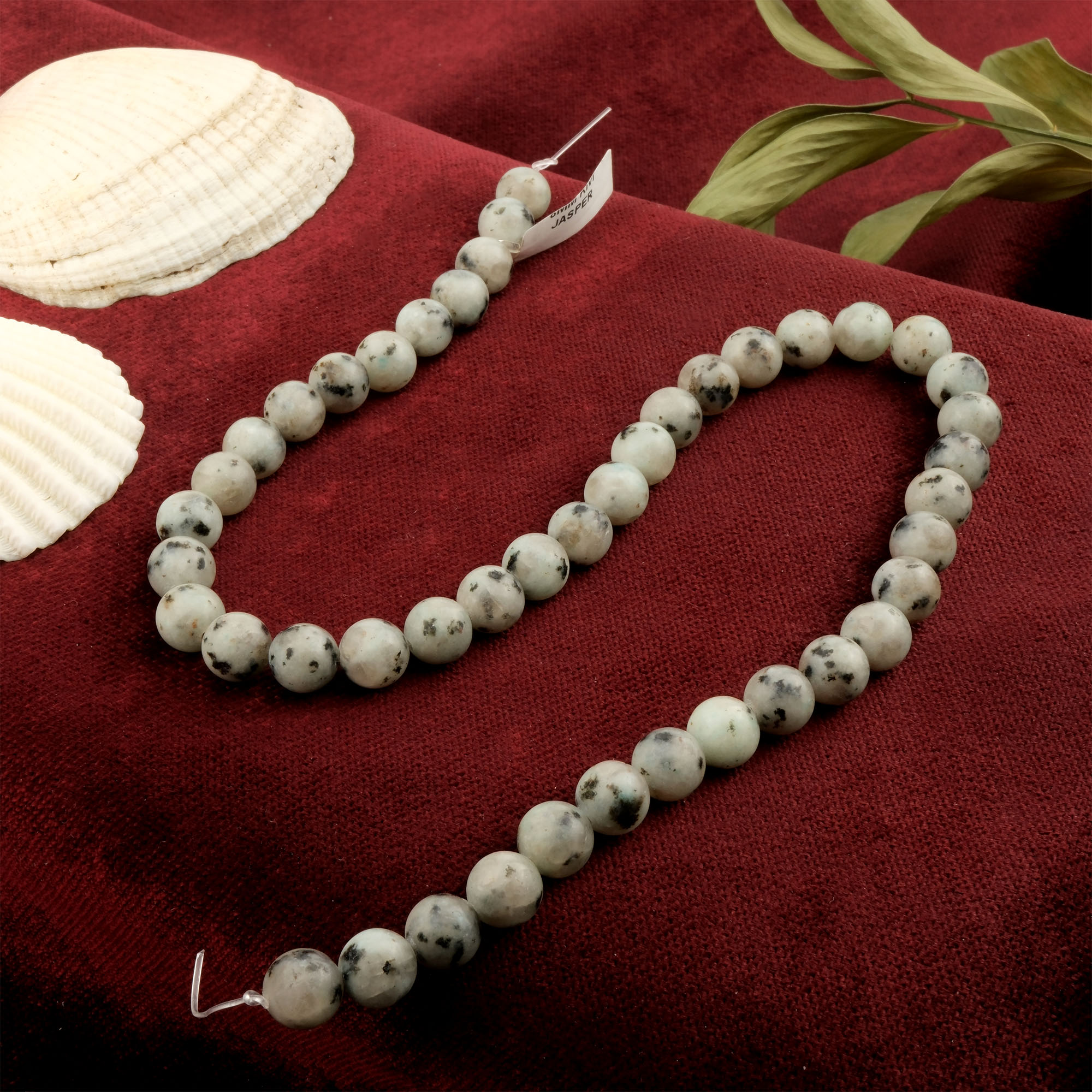 kivi-jasper-dizi-dogal-tas-dizi-8mm-safir-tas-evi- (4) Kivi Jasper doğal taş dizi 8mm – açık yeşil zemin üzerindeki siyah benekleriyle denge ve sakinlik enerjisi yayan toptan doğal taş dizi.