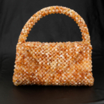 Luxury golden yellow natural stone bag handcrafted using approximately 2000 pieces of 8mm facet cut original citrine stones.