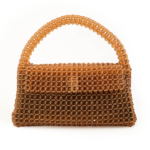 Luxury natural stone bag handcrafted using approximately 2300 pieces of 7mm facet cut zultanite stones that change color according to light.