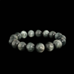 Bracciale flessibile in pietra naturale realizzato con perle rotonde e lisce di occhio di gatto grigio.
