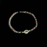 A luxury designer women's bracelet featuring original faceted cut multicolor tourmaline stones set in 925 sterling silver with a central green tourmaline focus.