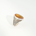 A luxury handmade statement ring featuring an original 11.35ct oval yellow sapphire gemstone set in 925 sterling silver with engraved details.