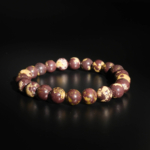 A stylish gemstone statement bracelet featuring original 9-10mm chocolate jasper round beads on a stretch band.