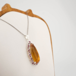 Pendentif de luxe en argent sterling 925 orné d'une citrine originale coupe marquise et de tourmalines roses.