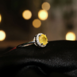 A delicate women's statement ring featuring a round-cut original yellow sapphire gemstone surrounded by cubic zirconia in 925 sterling silver.
