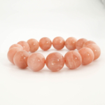 Bracelet orné de perles rondes de 15-16mm en pierre de soleil naturelle originale de qualité 4A+ aux reflets dorés.