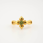 A luxury women's solitaire ring featuring an original round faceted peridot gemstone set in a gold-plated 925 sterling silver flower prong design.