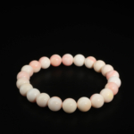 Raffinato bracciale elastico da donna con perle sferiche in opale rosa naturale 8-9 mm.