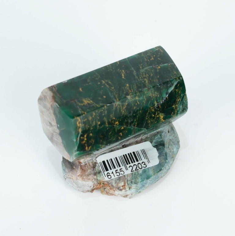An authentic 125g Brazilian green jade polished freestanding geometric prism gemstone specimen on natural matrix base.