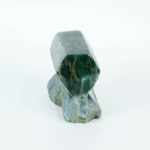 An authentic 470g Brazilian green jade polished freestanding geometric prism gemstone specimen on natural matrix base.