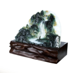 An authentic 28.9kg masterfully hand-carved natural fluorite 3D mountain and waterfall scenery sculpture on a custom wooden stand.