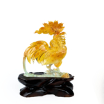 An authentic 9.25kg hand-carved natural honey onyx rooster statue displayed on a carved wooden base.