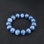 A natural premium blue kyanite gemstone stretch bracelet featuring large 14-15mm round beads.