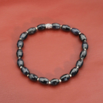 An authentic natural blue sapphire 6x8.6mm faceted gemstone stretch bracelet with 925 sterling silver beads.
