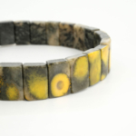 An authentic natural bumblebee jasper rolex cut beaded stretch bracelet for men and women.