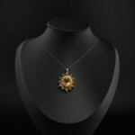 Natural yellow citrine gemstone flower cluster pendant necklace in 925 sterling silver on white silk.