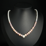 A luxurious 925 silver women's necklace featuring natural graduated multi-color pastel ocean pearls.