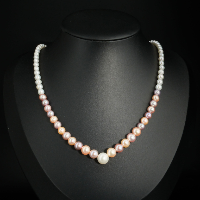 A luxurious 925 silver women's necklace featuring natural graduated multi-color pastel ocean pearls.