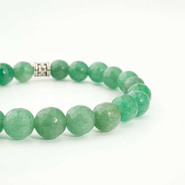 An authentic 8mm faceted cut natural green aventurine beaded stretch bracelet with silver tone accent.