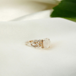 An adjustable 925 sterling silver women's ring featuring a natural oval cabochon white moonstone gemstone.