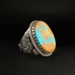 A handcrafted 925 sterling silver men's ring featuring a large natural Neyshabur turquoise gemstone with authentic matrix patterns.