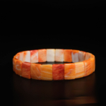 An authentic natural orange mother of pearl rolex cut beaded stretch bracelet.