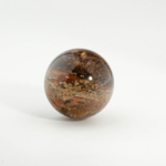 An authentic 3-3.5cm natural lodolite garden quartz crystal sphere with golden pyrite inclusions.