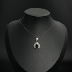 925 sterling silver women necklace featuring a faceted oval red natural garnet gemstone pendant.