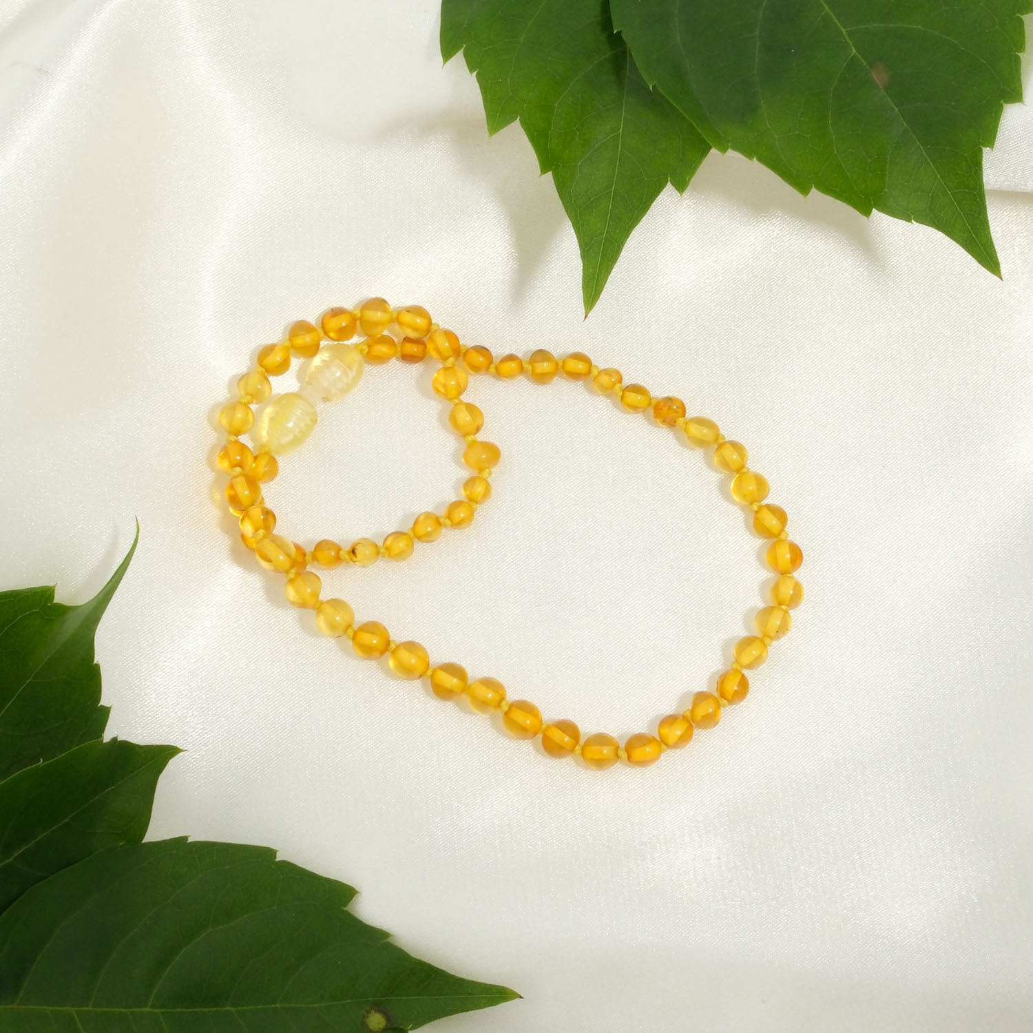 sertifikali-baltik-kehribar-limon-sari-bebek-kolyesi-konya-dogal-tas-evi Konya Doğal Taş Evi sertifikalı orijinal Baltık kehribar limon sarısı bebek kolyesi 3-4 gram.