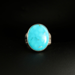 A 925 sterling silver handmade men's ring featuring a natural large vertical oval cabochon cut Arizona blue turquoise gemstone.