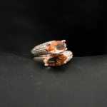 An authentic natural color-change faceted double marquise zultanite gemstone 925 sterling silver ring with cz stones.