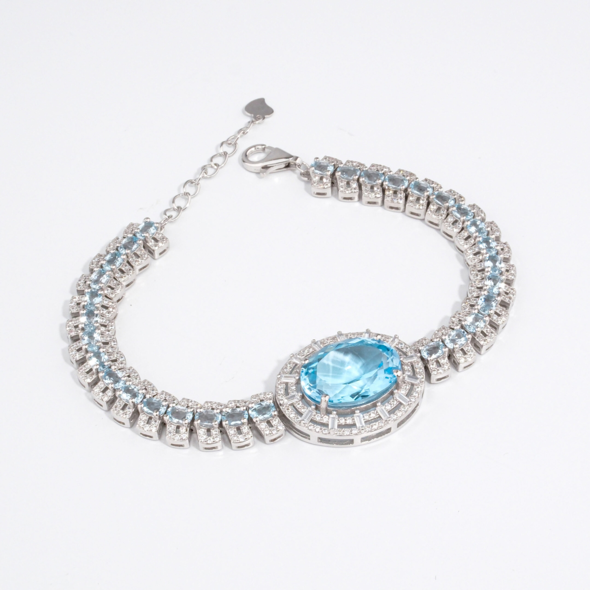 Bracelet de haute joaillerie pour femme en argent 925 rhodié serti d'une topaze bleue naturelle et zircons.