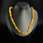 Genuine certified Baltic amber natural stone graduated flat olive bead adult necklace.