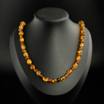 Genuine certified Baltic amber natural stone long graduated button bead adult necklace.