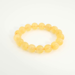 Hochwertiges Edelsteinarmband aus echtem gelbem Fluorit in 6A+ Spitzenqualität mit 12-13mm Perlen.
