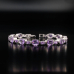 An authentic natural purple amethyst gemstone oval and round faceted link 925 sterling silver bracelet.