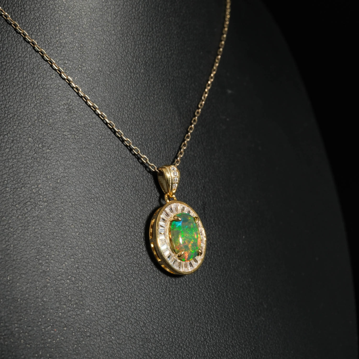An authentic natural black opal gemstone cabochon baguette cut zircon halo gold plated 925 silver pendant necklace.