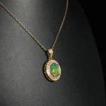 An authentic natural black opal gemstone cabochon baguette cut zircon halo gold plated 925 silver pendant necklace.