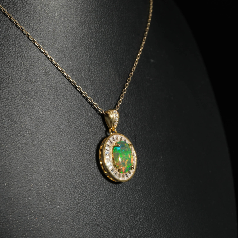 An authentic natural black opal gemstone cabochon baguette cut zircon halo gold plated 925 silver pendant necklace.