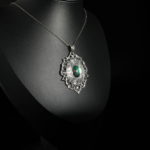 An authentic natural black opal gemstone cabochon vintage hand engraved 925 sterling silver medallion pendant necklace.