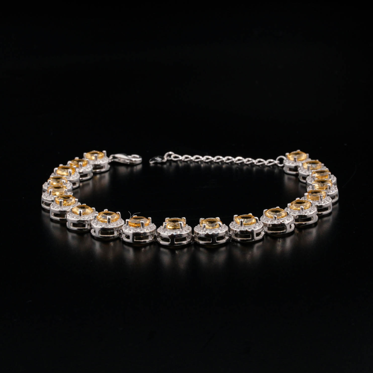 An authentic natural yellow citrine gemstone round faceted zircon halo 925 sterling silver tennis bracelet.