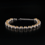 An authentic natural yellow citrine gemstone round faceted zircon halo 925 sterling silver tennis bracelet.