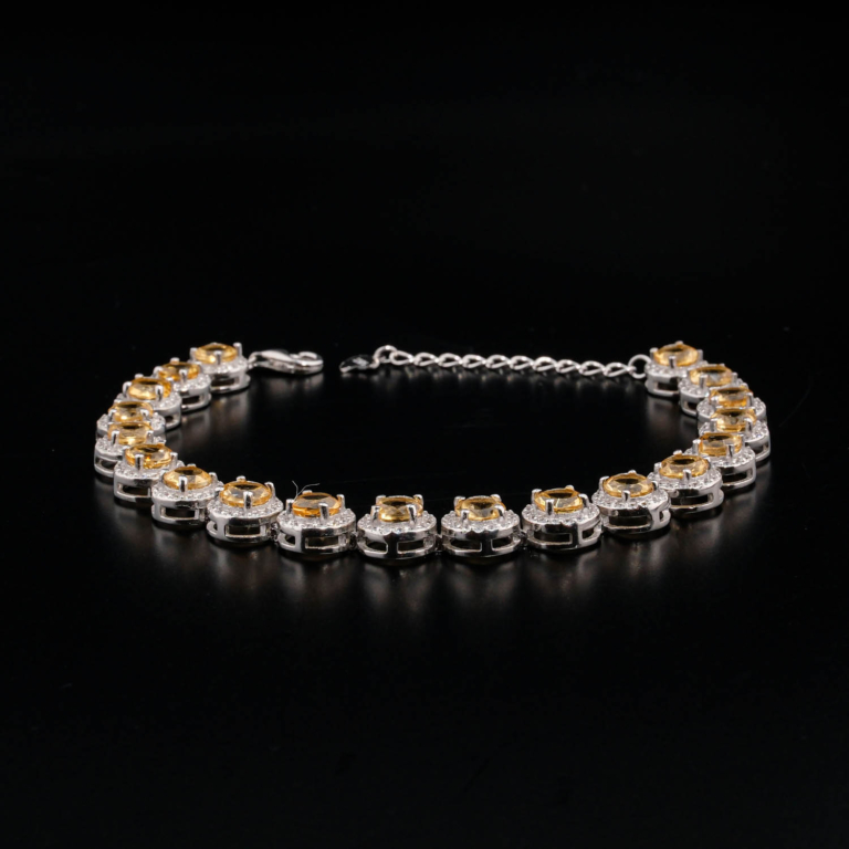 An authentic natural yellow citrine gemstone round faceted zircon halo 925 sterling silver tennis bracelet.