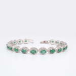 An authentic natural faceted oval green emerald gemstone 925 sterling silver luxury halo tennis bracelet 19cm.