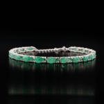 An authentic natural green emerald gemstone oval and round faceted link 925 sterling silver bracelet.