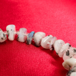 An authentic natural freeform nugget white moonstone gemstone beaded stretch bracelet with blue sheen.