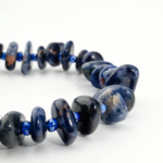 An authentic natural freeform nugget dark blue sodalite gemstone beaded stretch bracelet.
