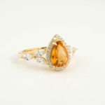 An authentic natural golden yellow faceted pear-cut citrine gemstone 14k gold plated 925 silver ring with marquise side stones.