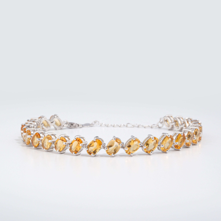 An authentic natural faceted oval golden yellow citrine gemstone 925 sterling silver tennis bracelet.