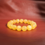An authentic 6A+ gem grade natural golden yellow fluorite gemstone bead bracelet 12-13mm.